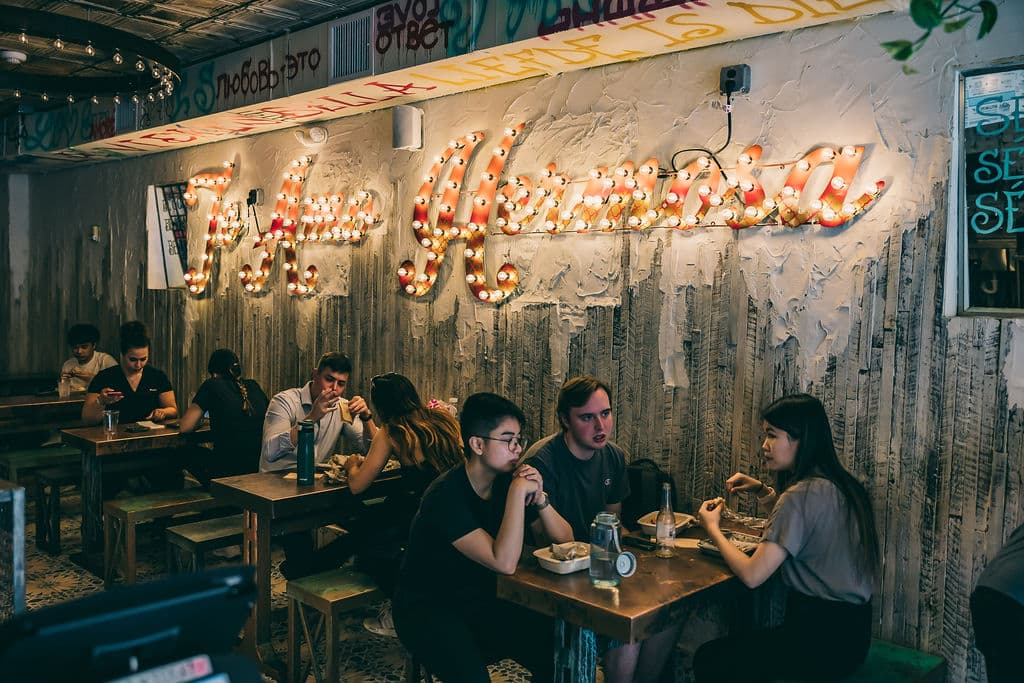 Interior of Hoboken location with people enjoying tacos