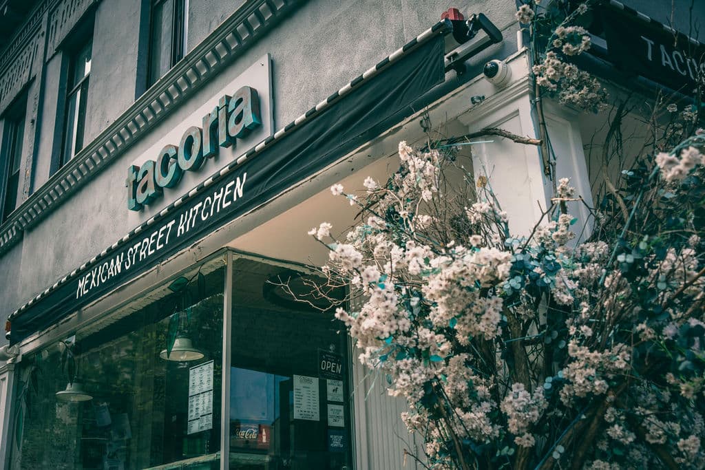 Exterior of the building with blue siding and white walls